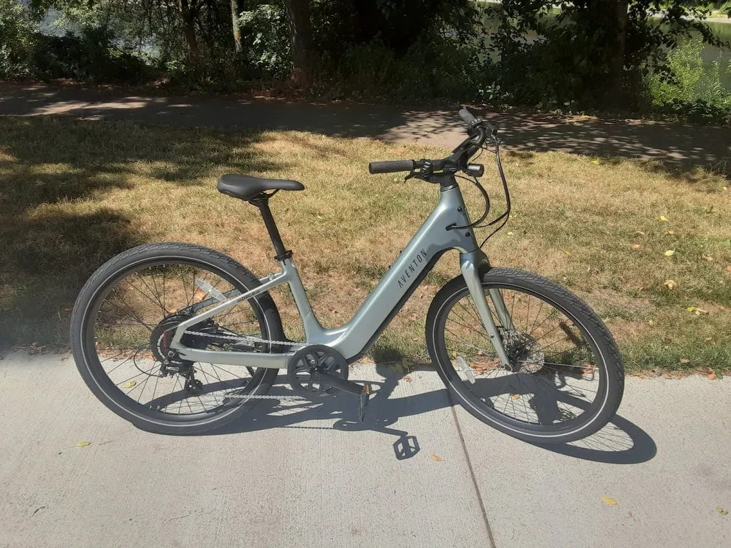 Aventon Pace 5 REC comfort cruiser e-bike in sage on a park path